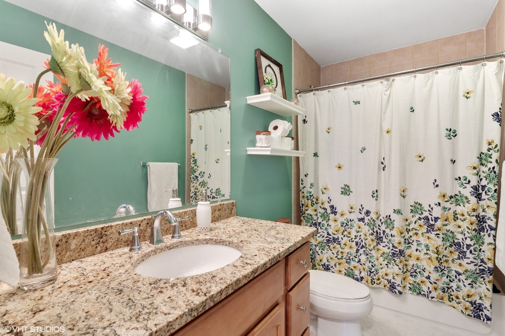 972 West Irving Park Road, Unit 3 Bensenville, IL 60106 - Photo 15 of 19 a bathroom with a granite countertop sink a toilet and a mirror