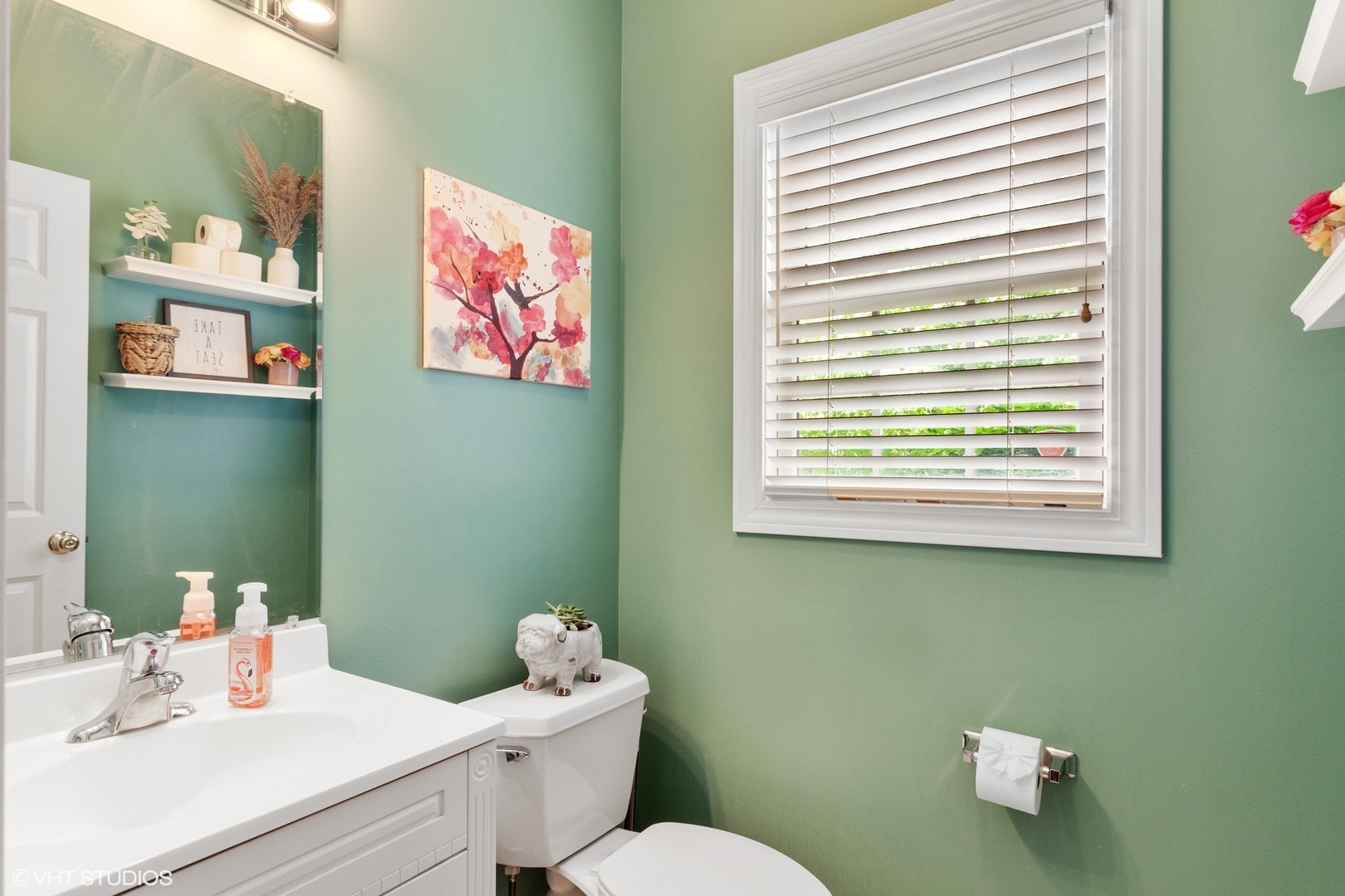 972 West Irving Park Road, Unit 3 Bensenville, IL 60106 - Photo 18 of 19 a bathroom with a toilet a sink and a window
