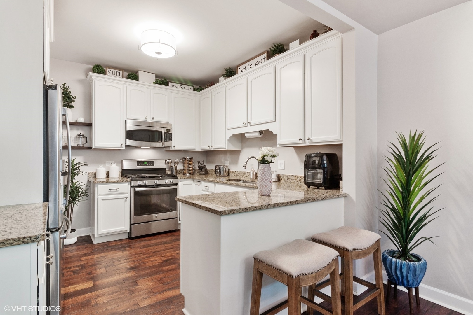 972 West Irving Park Road, Unit 3 Bensenville, IL 60106 - Photo 6 of 19 a kitchen with stainless steel appliances granite countertop a refrigerator sink and stove