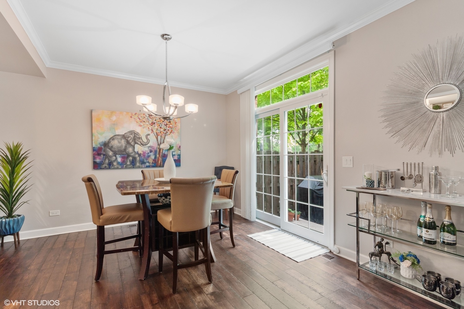 972 West Irving Park Road, Unit 3 Bensenville, IL 60106 - Photo 7 of 19 a dining room with furniture a chandelier and wooden floor