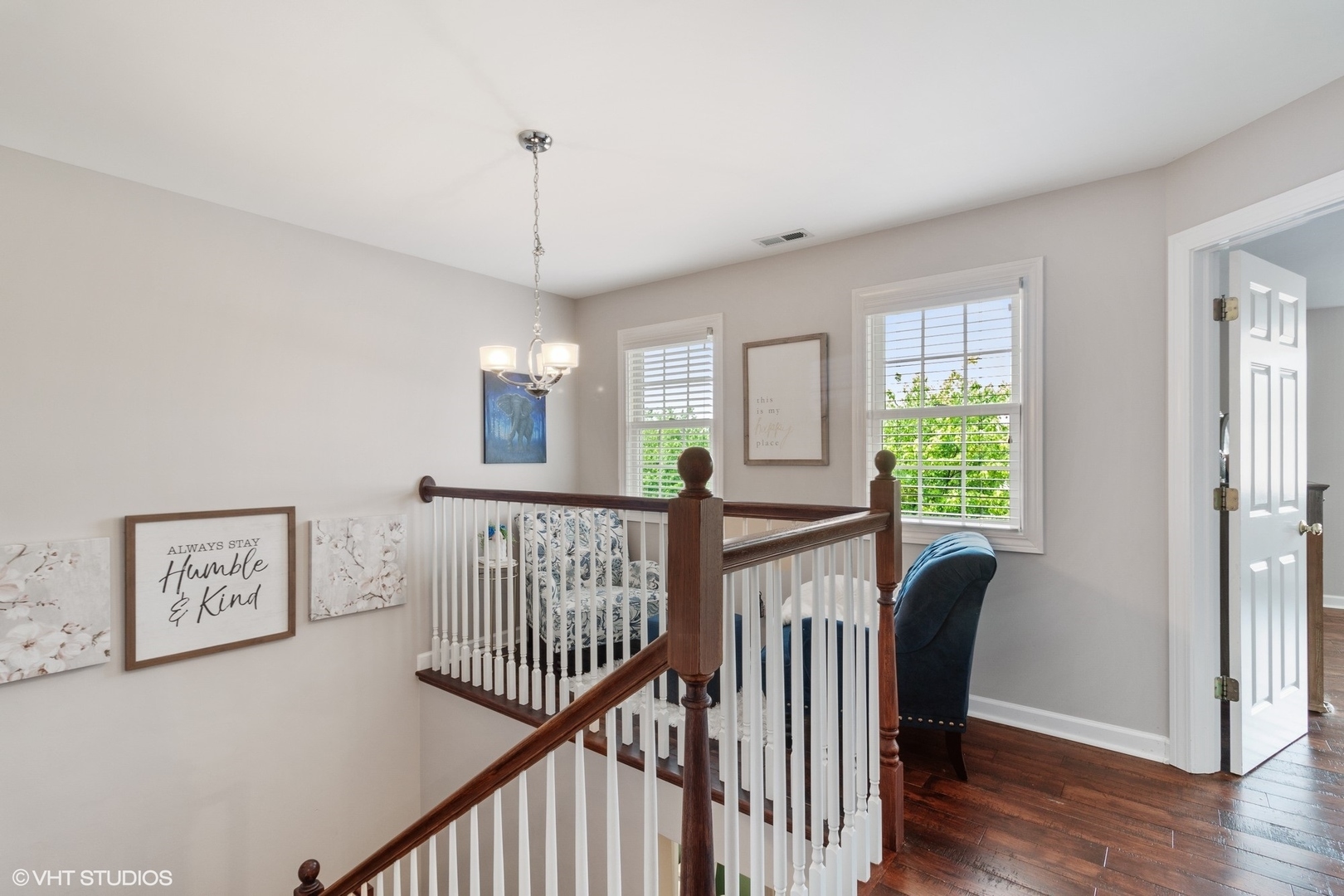972 West Irving Park Road, Unit 3 Bensenville, IL 60106 - Photo 9 of 19 a view of a room with wooden floor windows and a chandelier