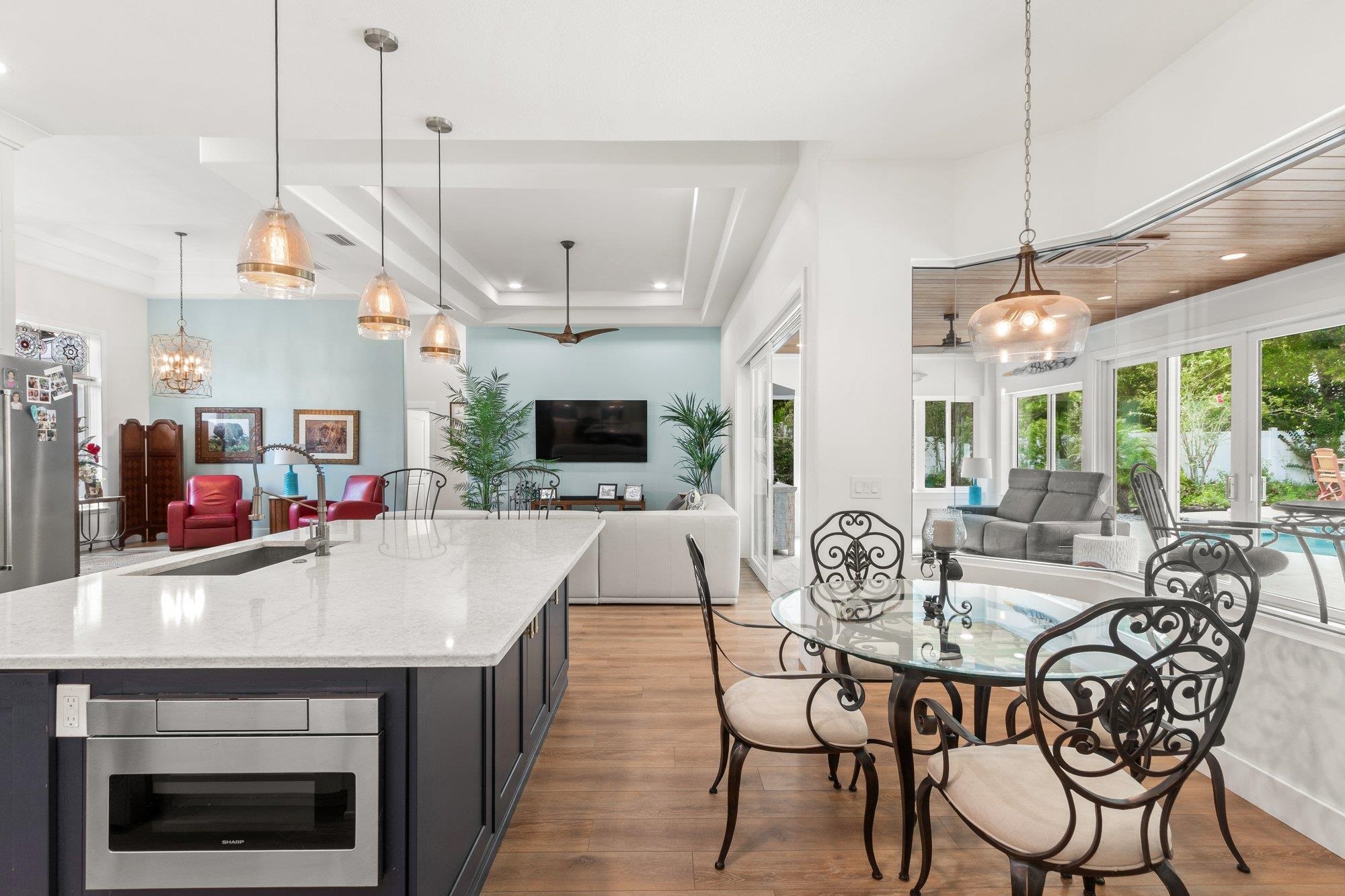 3432 Kings Road South St. Augustine, FL 32086 - Photo 19 of 47 a view of a dining room with furniture window and wooden floor