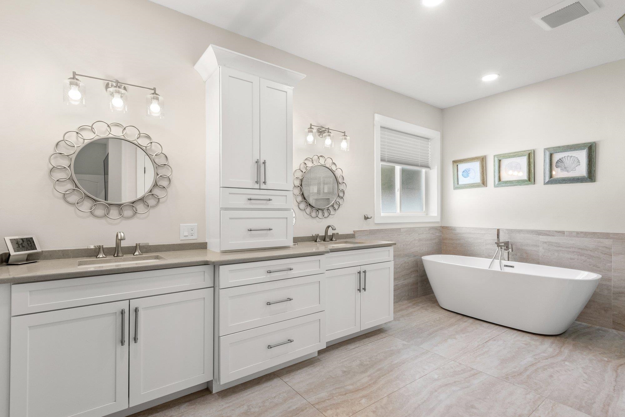 3432 Kings Road South St. Augustine, FL 32086 - Photo 25 of 47 a spacious bathroom with a double vanity sink double mirror and bathtub