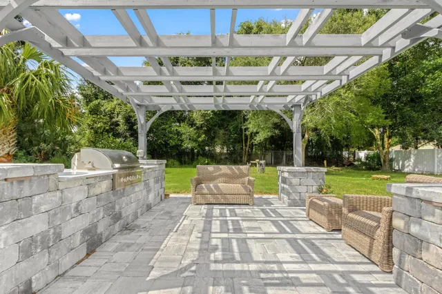 a view of a patio with a table and chairs