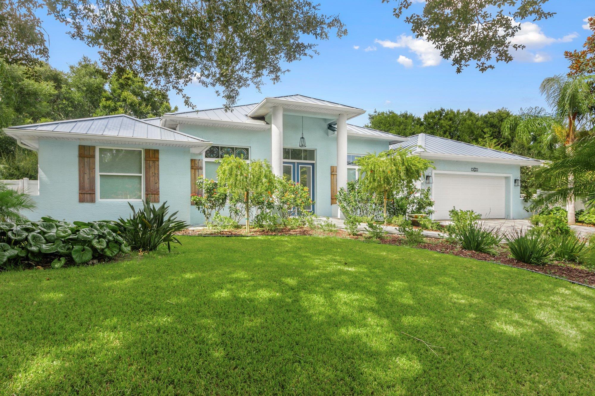 3432 Kings Road South St. Augustine, FL 32086 - Photo 5 of 47 a front view of a house with garden