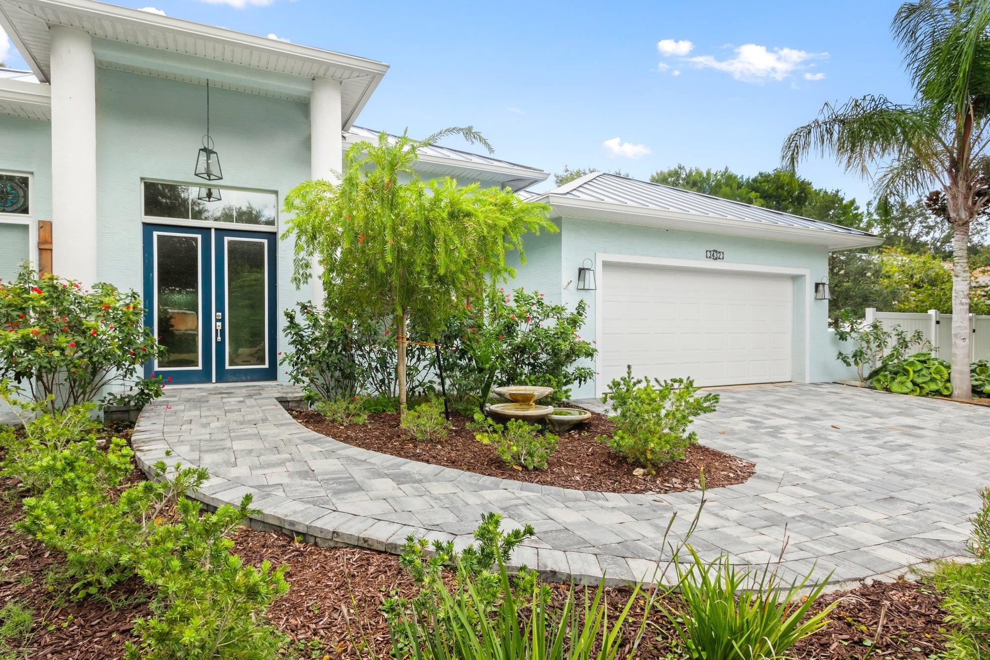 3432 Kings Road South St. Augustine, FL 32086 - Photo 6 of 47 a front view of a house with a yard and potted plants