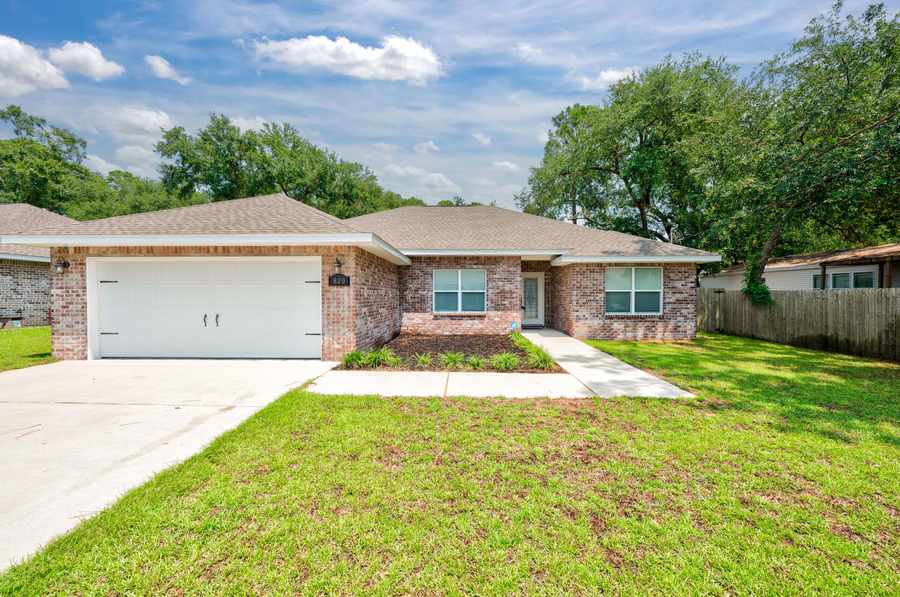 a house with swimming pool in front of it