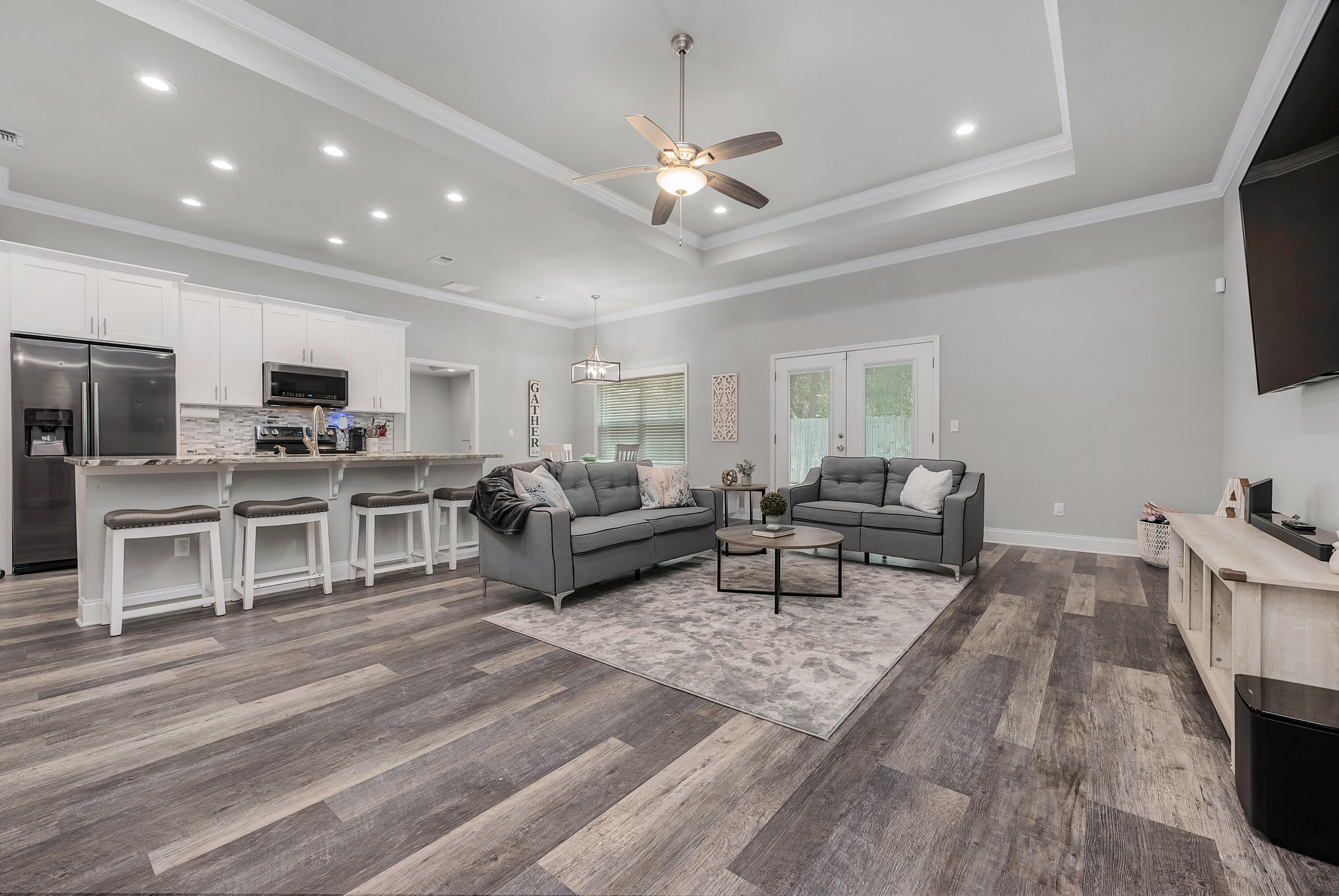 820 Hilltop Road Mary Esther, FL 32569 - Photo 17 of 47 a living room with furniture and a flat screen tv