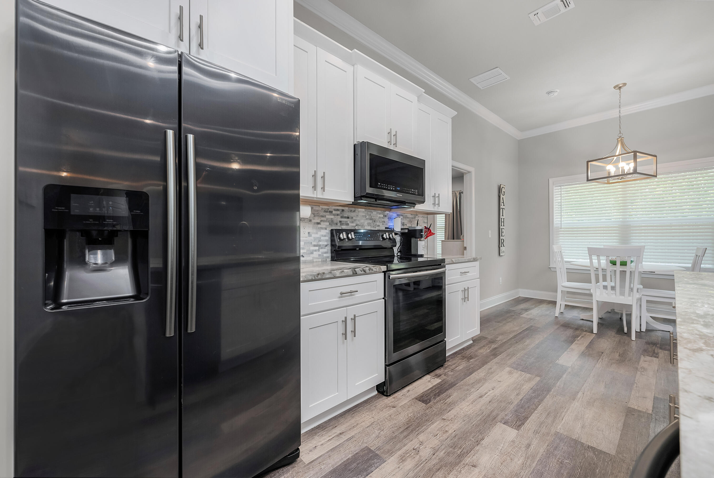 820 Hilltop Road Mary Esther, FL 32569 - Photo 22 of 47 a kitchen with a refrigerator and a stove top oven