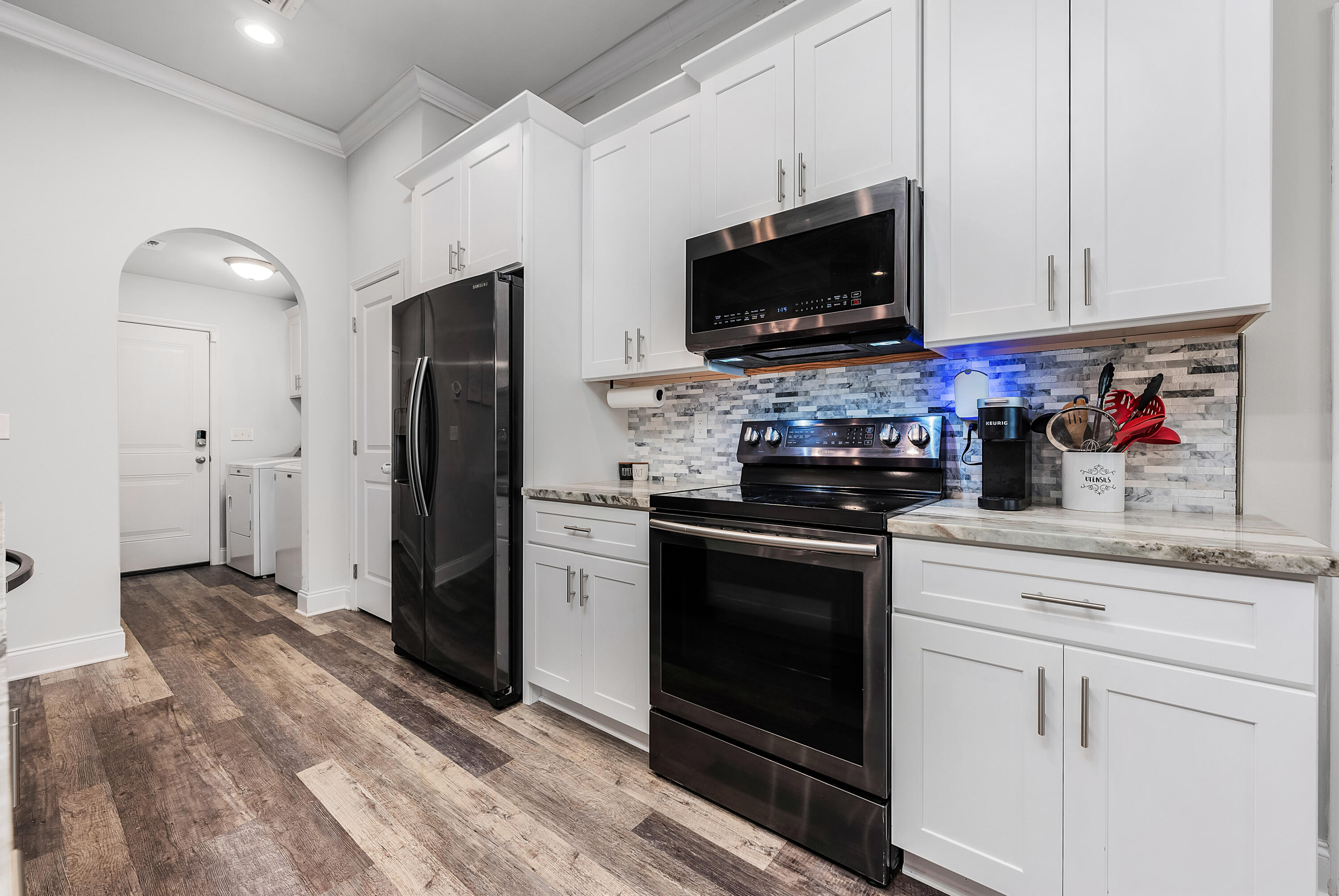 820 Hilltop Road Mary Esther, FL 32569 - Photo 24 of 47 a kitchen with stainless steel appliances granite countertop a stove a refrigerator and a microwave