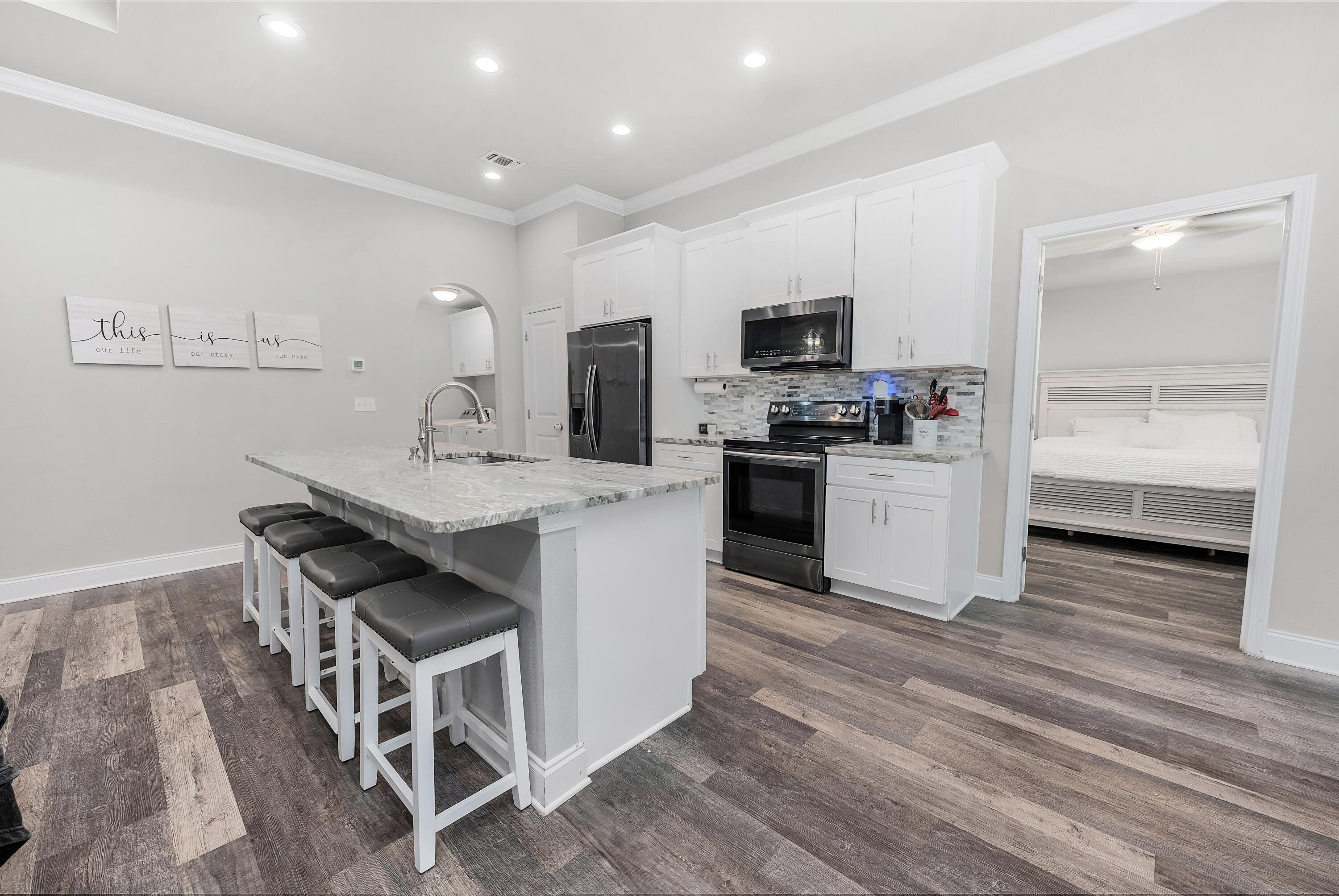 820 Hilltop Road Mary Esther, FL 32569 - Photo 25 of 47 a kitchen with a sink cabinets and wooden floor