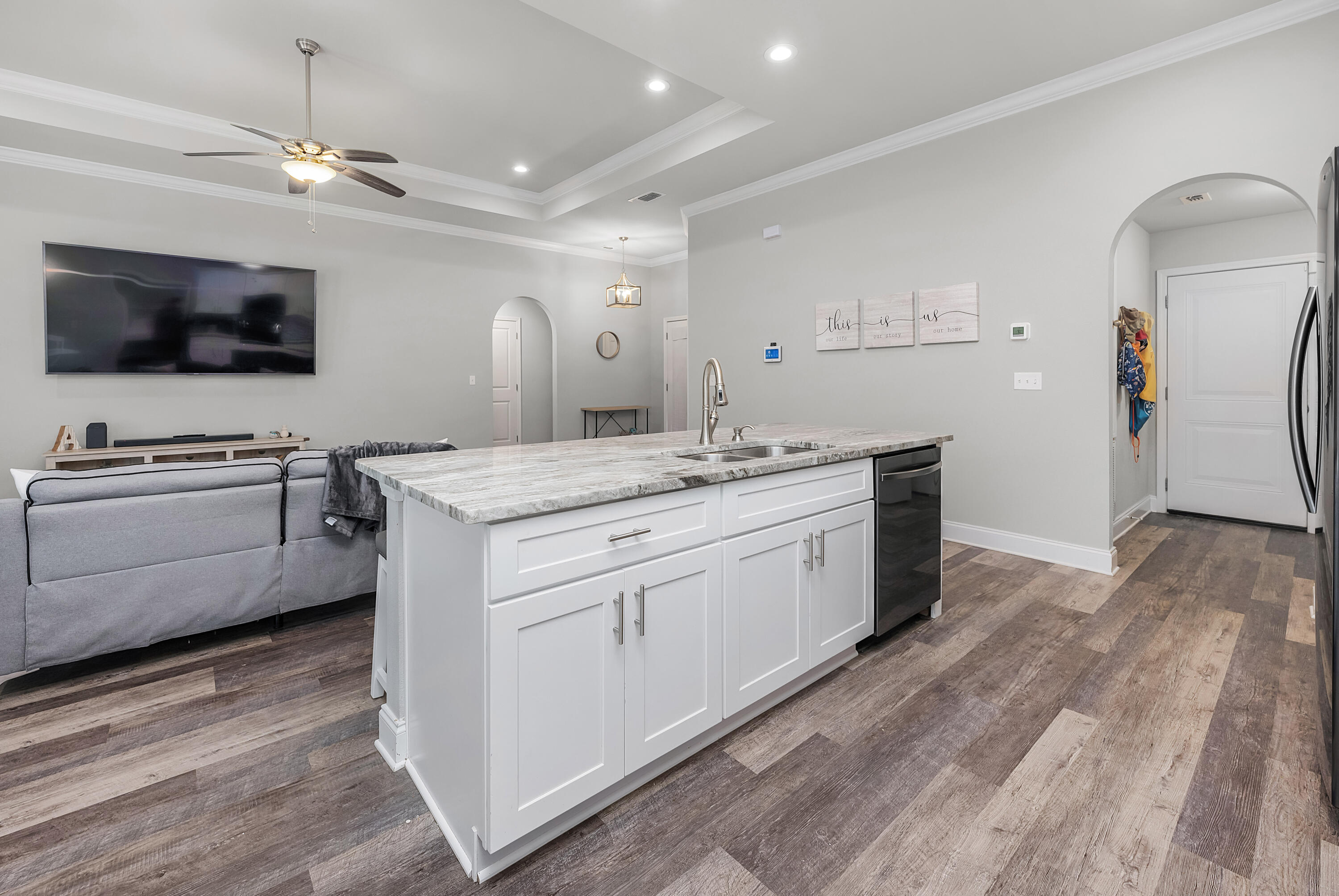 820 Hilltop Road Mary Esther, FL 32569 - Photo 26 of 47 a kitchen that has a lot of cabinets in it and wooden floor
