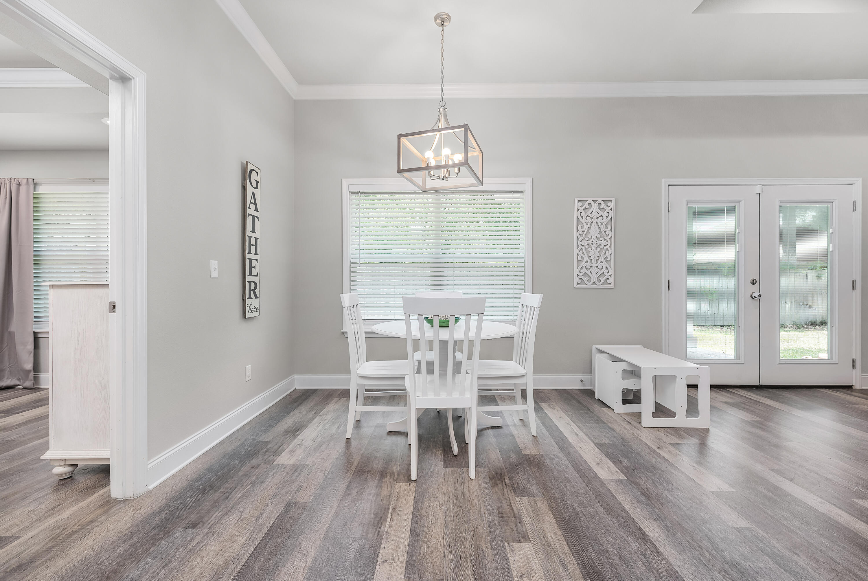 820 Hilltop Road Mary Esther, FL 32569 - Photo 27 of 47 a view of a dining room with furniture window and wooden floor