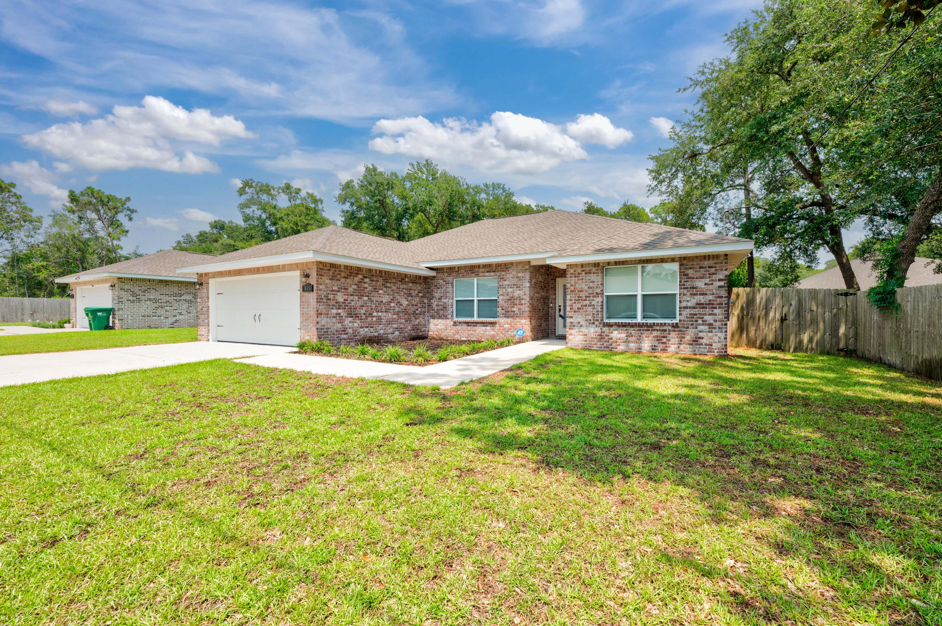 820 Hilltop Road Mary Esther, FL 32569 - Photo 3 of 47 a view of a house with a backyard