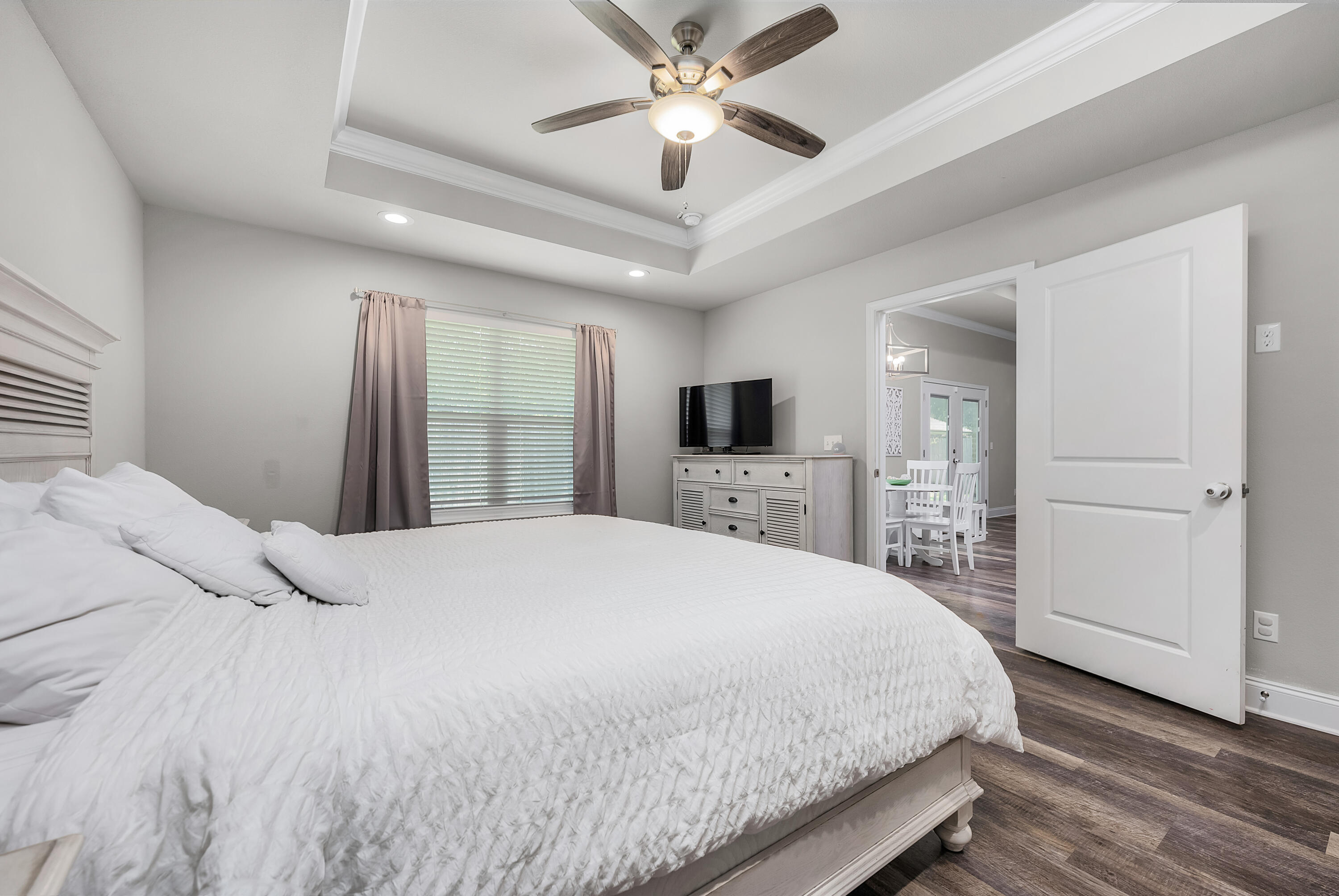 820 Hilltop Road Mary Esther, FL 32569 - Photo 32 of 47 a spacious bedroom with a bed and a flat screen tv