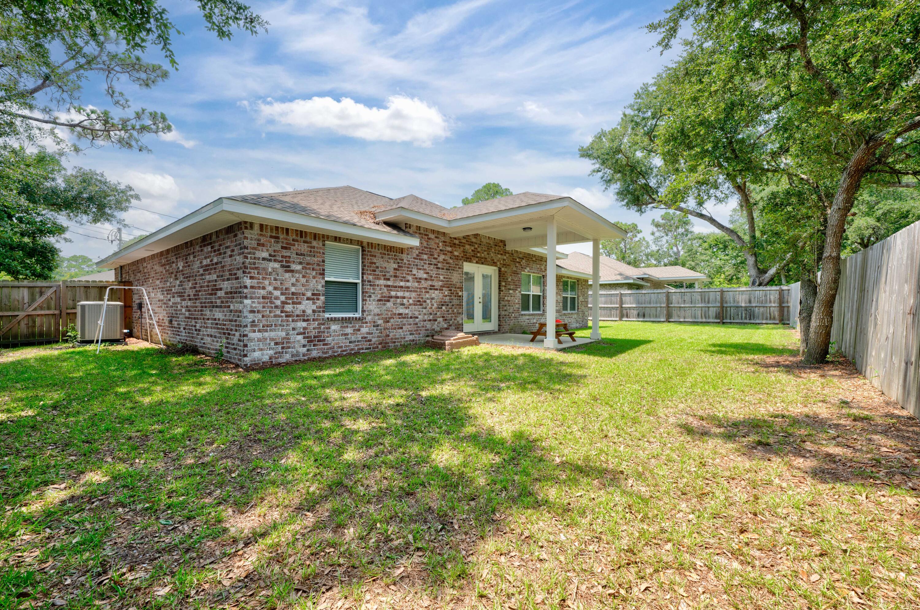 820 Hilltop Road Mary Esther, FL 32569 - Photo 43 of 47 a view of a house with a yard