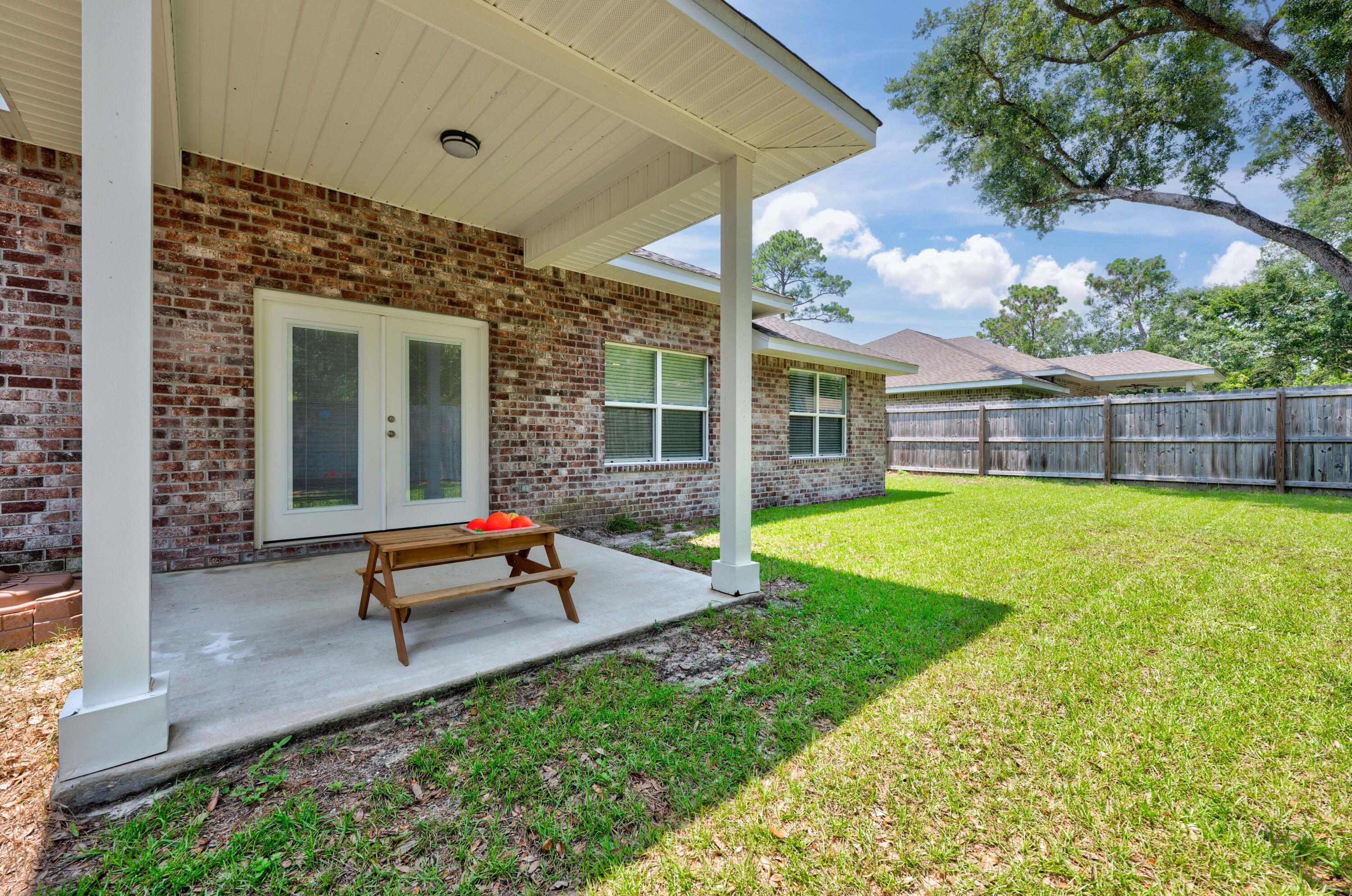 820 Hilltop Road Mary Esther, FL 32569 - Photo 44 of 47 a garden view with a seating space