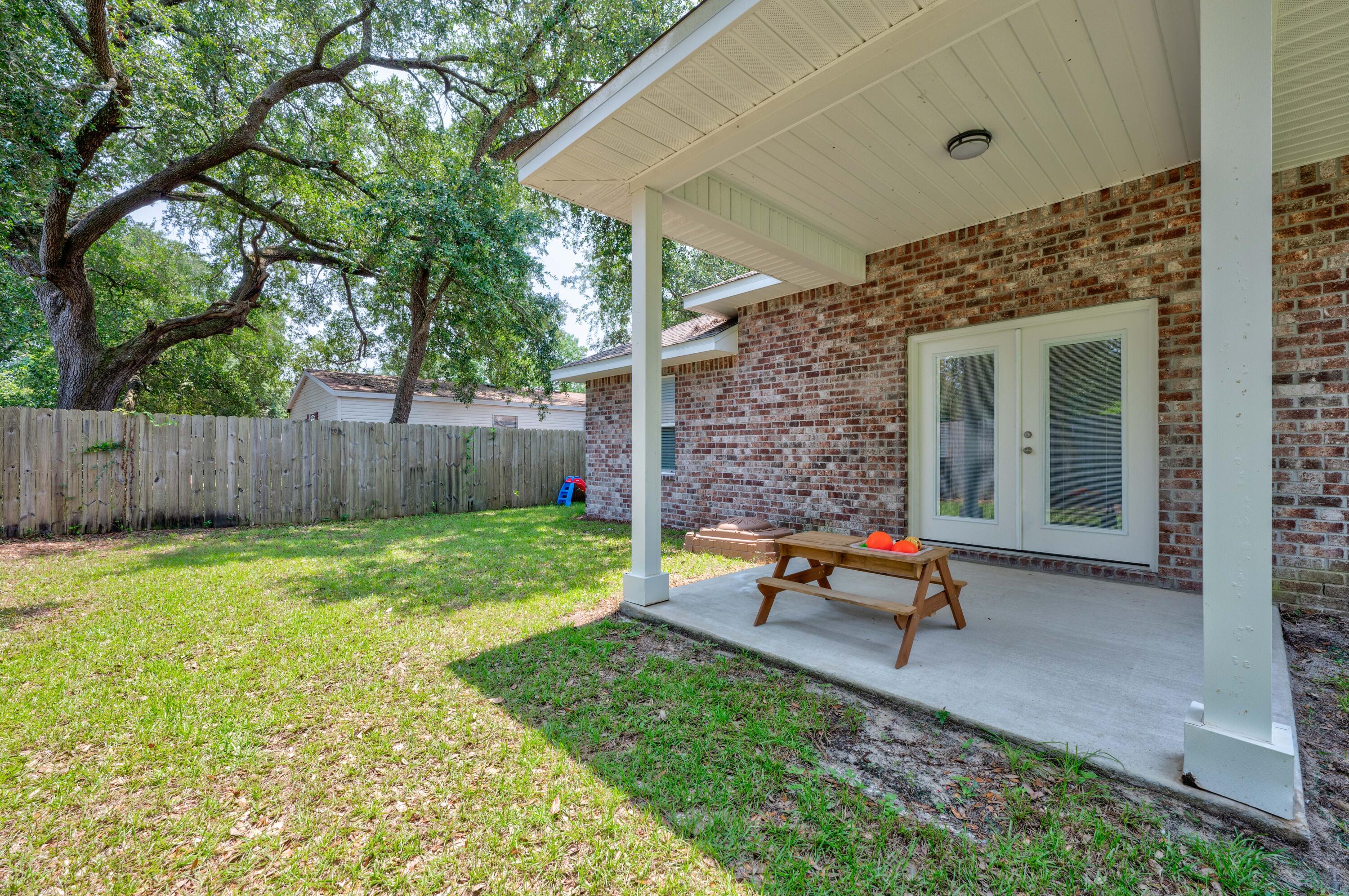 820 Hilltop Road Mary Esther, FL 32569 - Photo 45 of 47 a garden view with a seating space