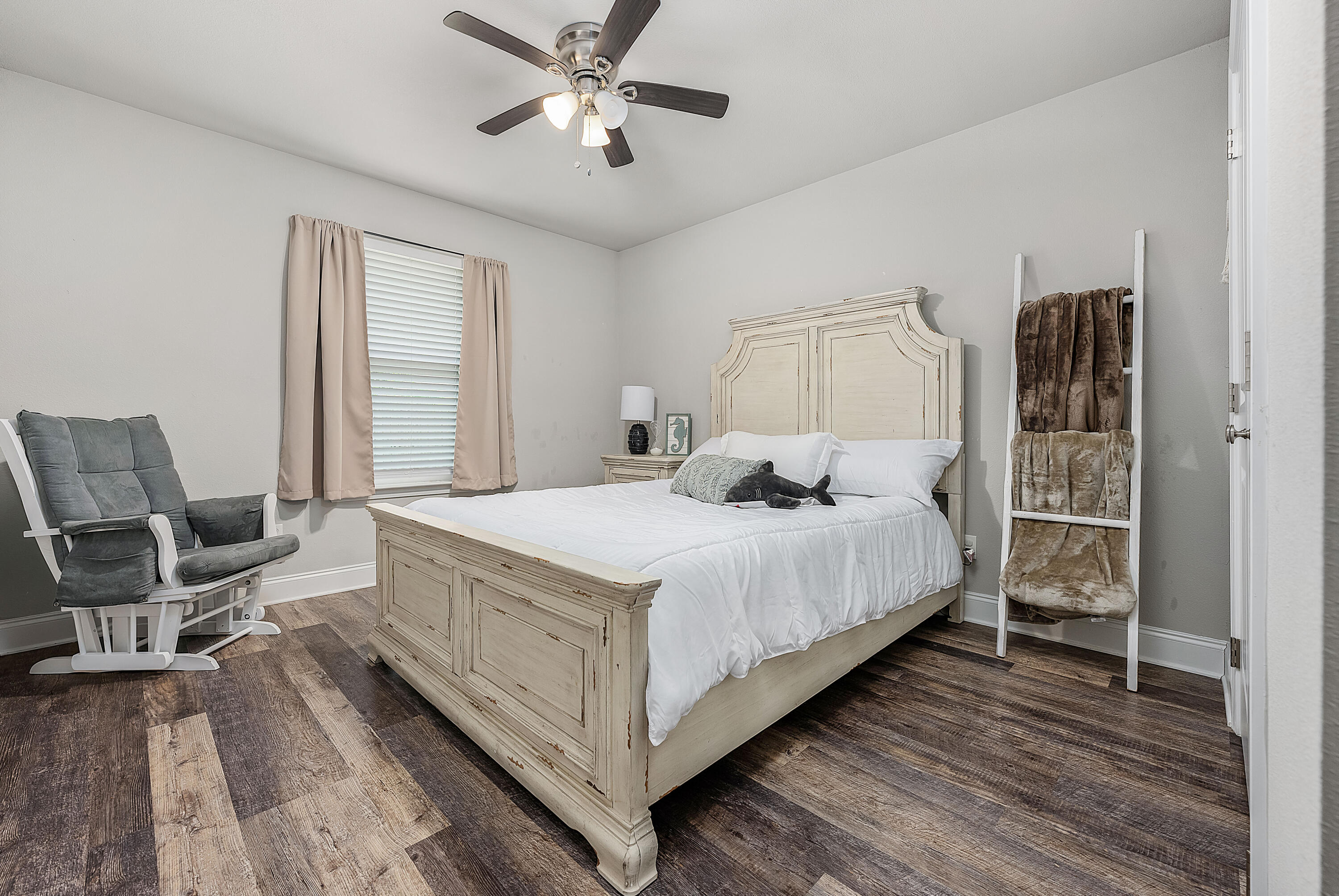 820 Hilltop Road Mary Esther, FL 32569 - Photo 6 of 47 a bedroom with a bed and a chandelier