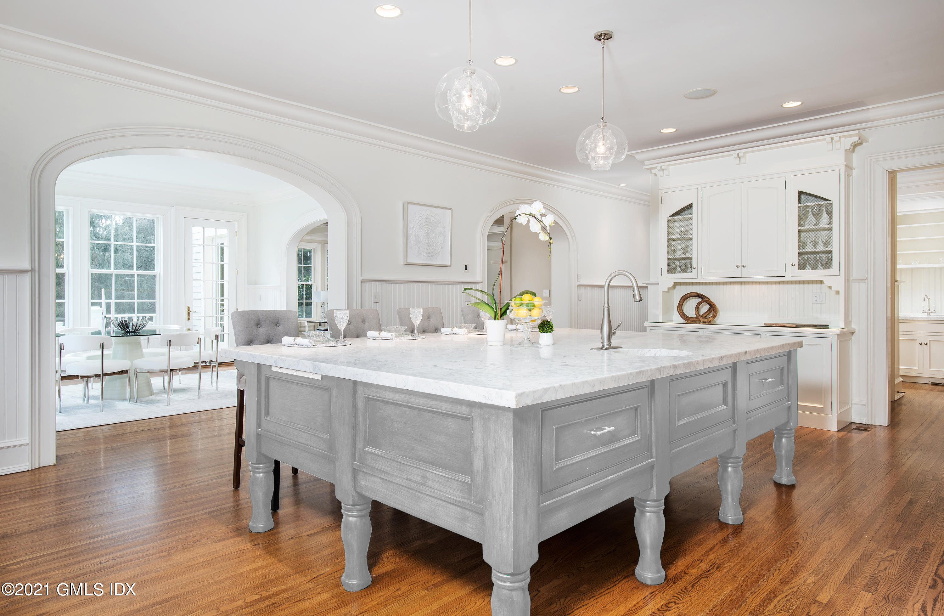 65 Clapboard Ridge Road Greenwich, CT 06830 - Photo 14 of 36 a kitchen with a sink cabinets and wooden floor