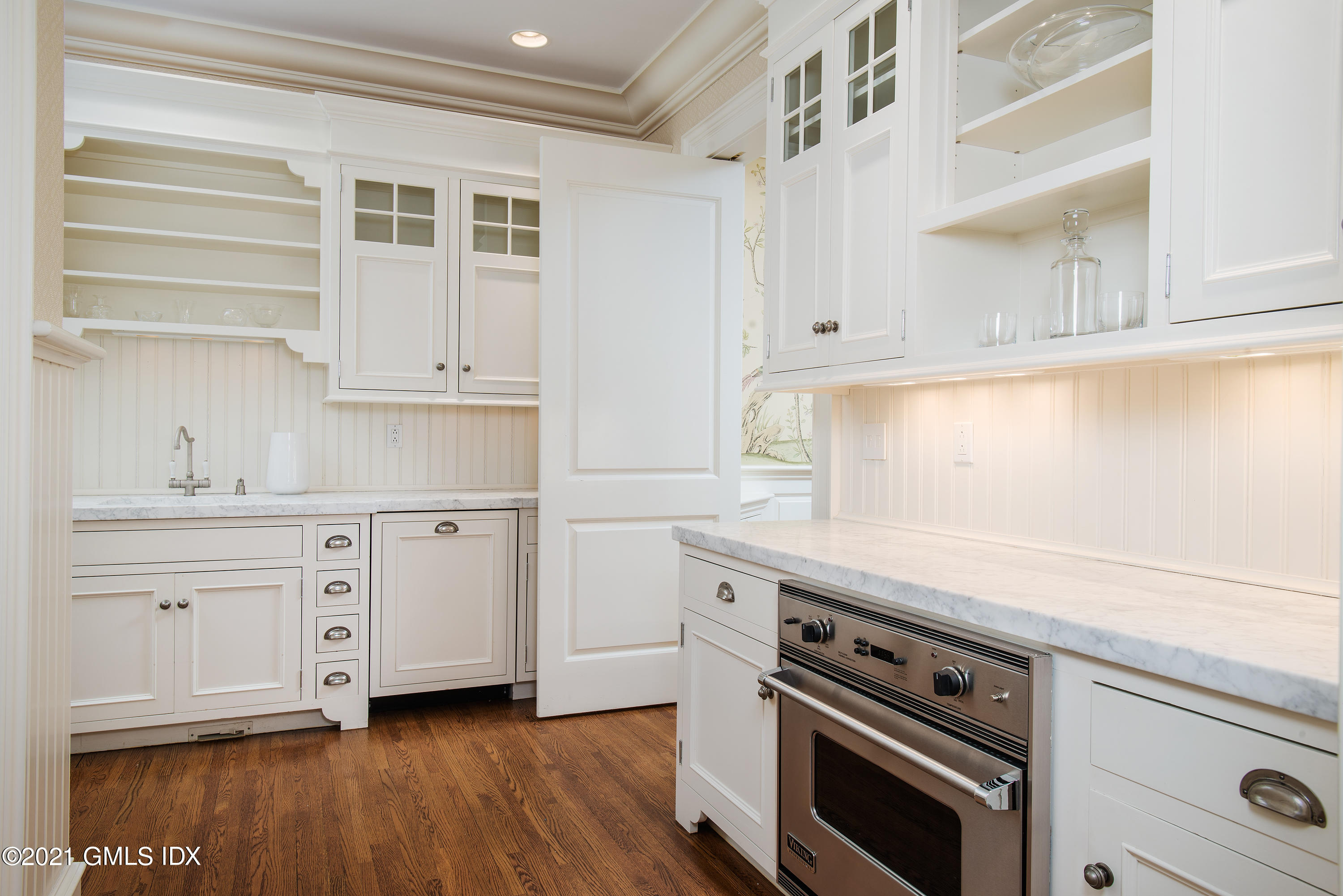 65 Clapboard Ridge Road Greenwich, CT 06830 - Photo 15 of 36 a kitchen with cabinets appliances a sink and a window