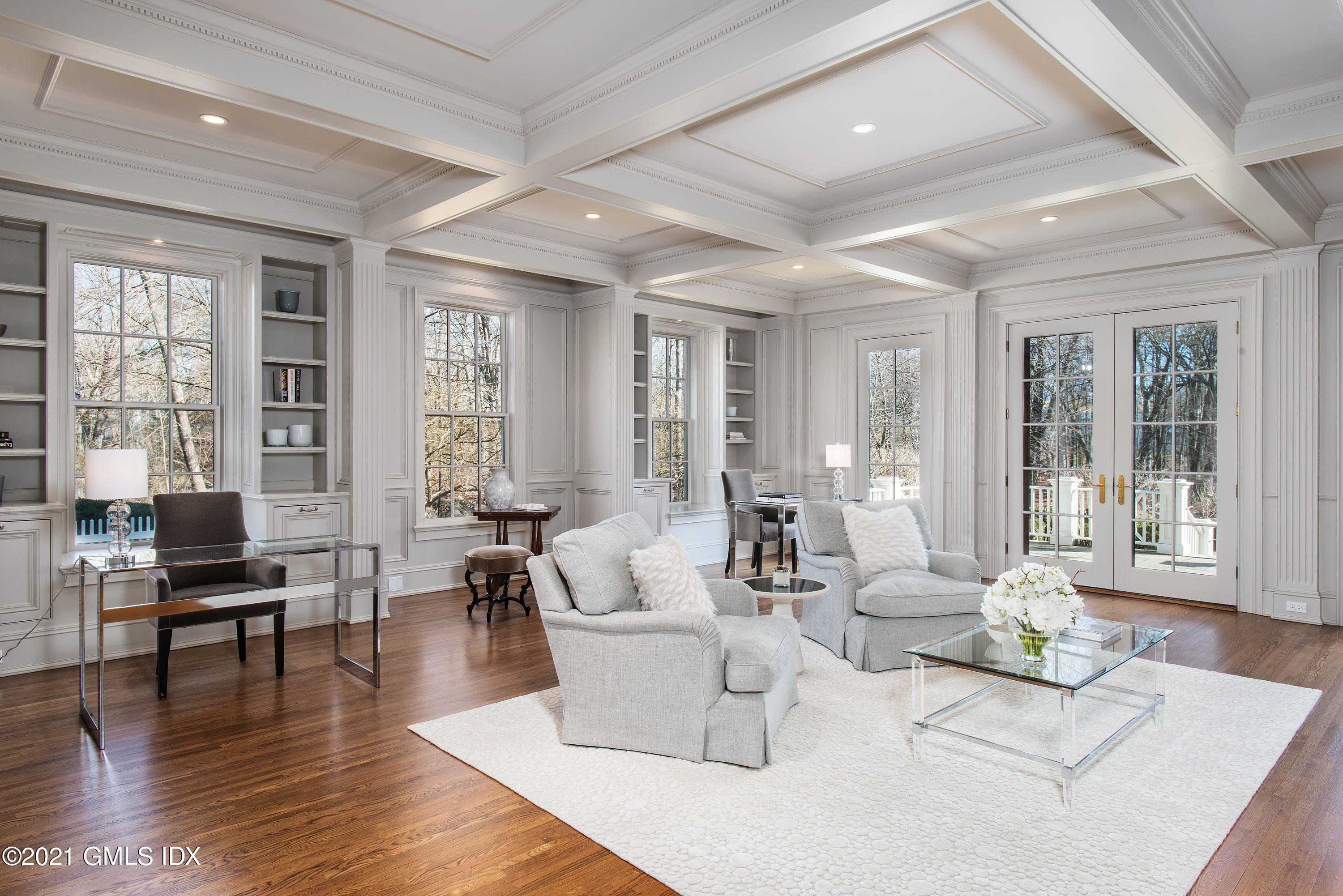 65 Clapboard Ridge Road Greenwich, CT 06830 - Photo 20 of 36 a living room with fireplace furniture and floor to ceiling windows