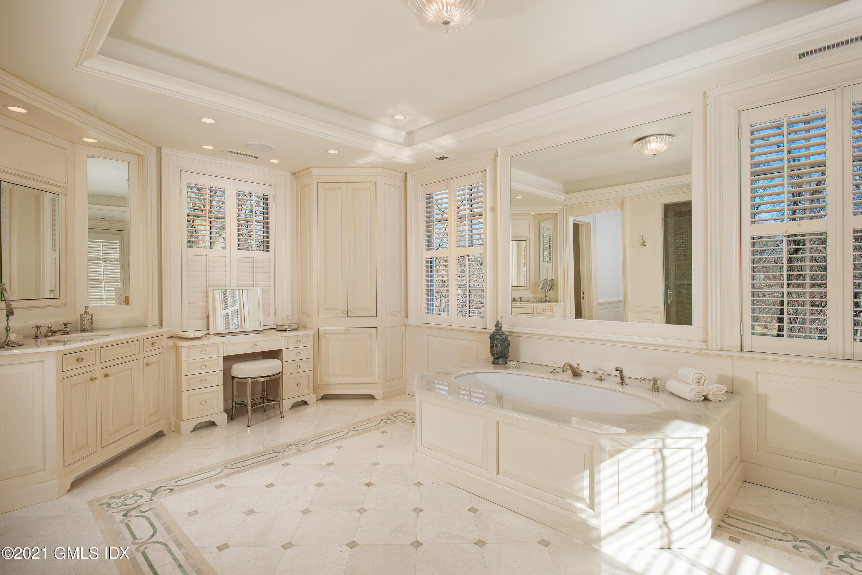 65 Clapboard Ridge Road Greenwich, CT 06830 - Photo 26 of 36 a large bathroom with sinks mirror and a bathtub