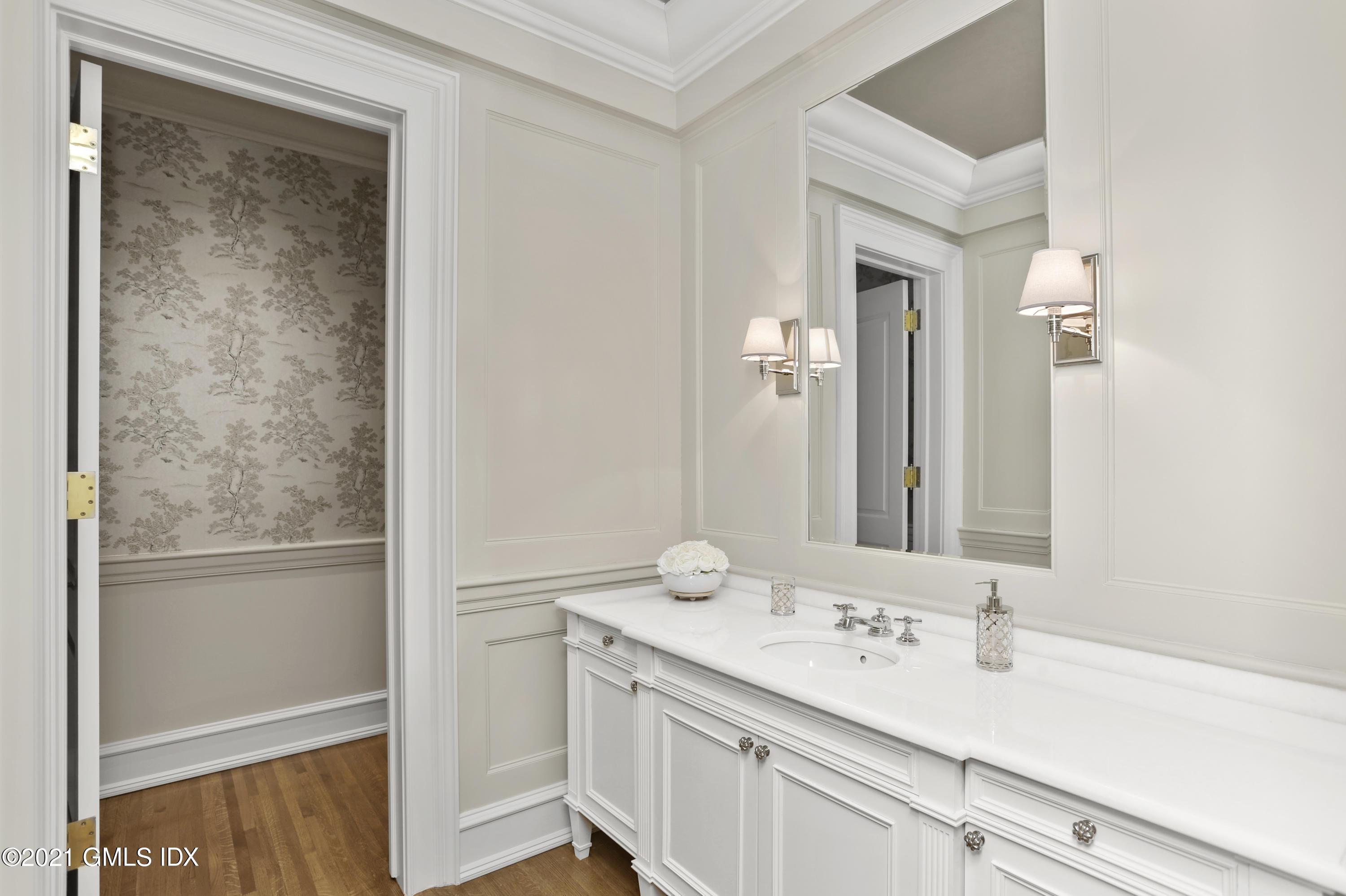 65 Clapboard Ridge Road Greenwich, CT 06830 - Photo 30 of 36 a bathroom with a sink and a mirror