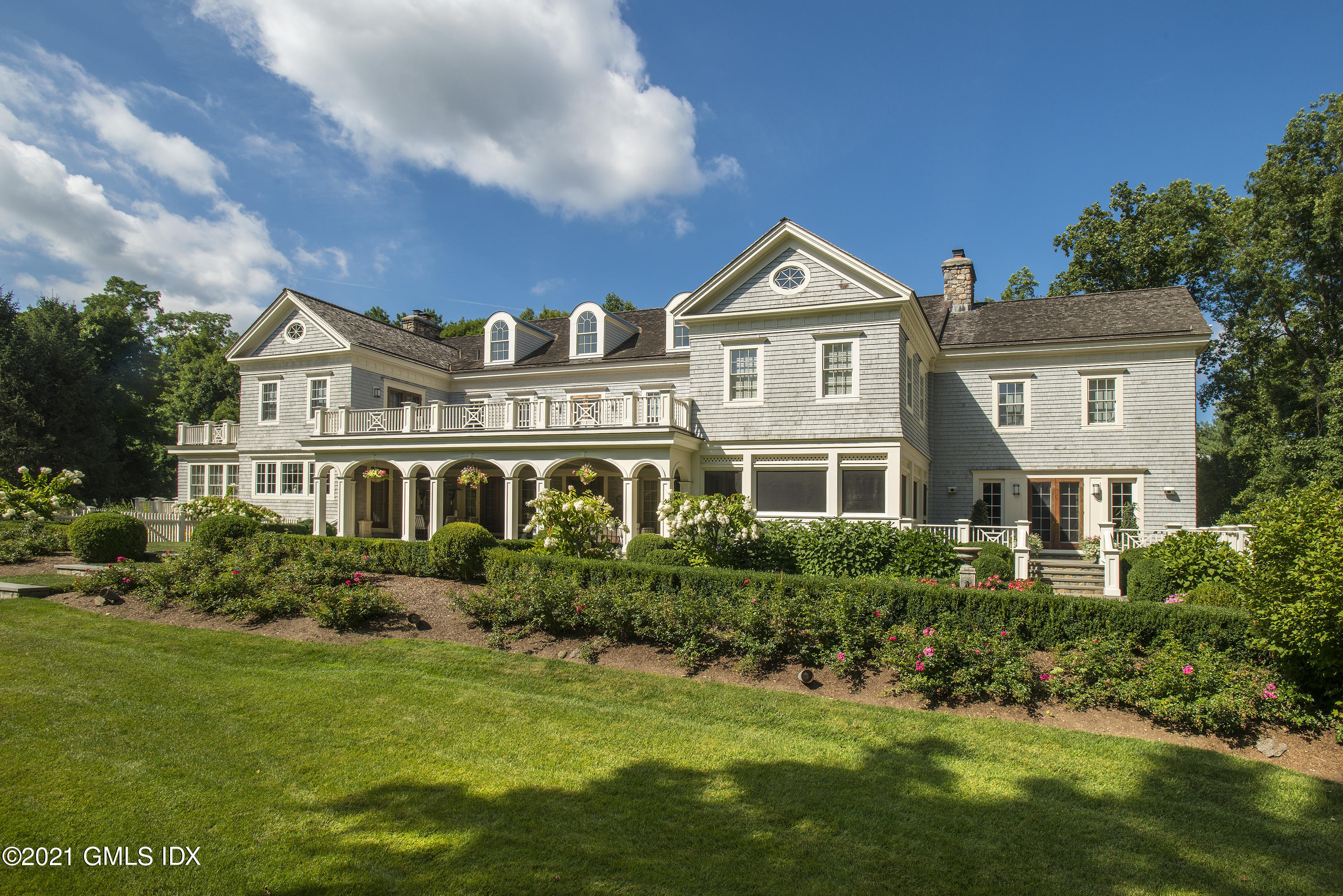 65 Clapboard Ridge Road Greenwich, CT 06830 - Photo 36 of 36 a front view of a house with a yard