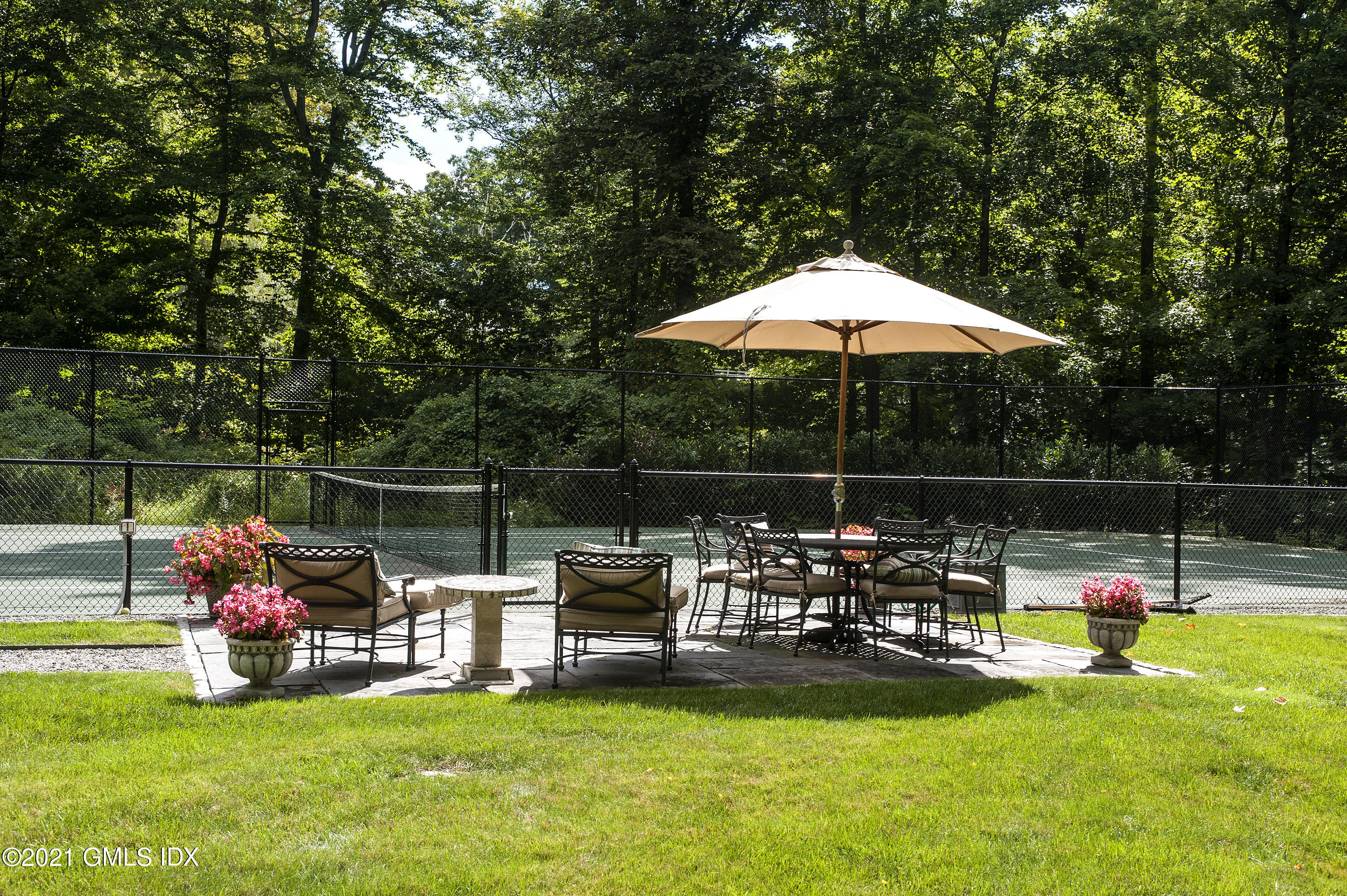 65 Clapboard Ridge Road Greenwich, CT 06830 - Photo 4 of 36 a view of a garden with lawn chairs