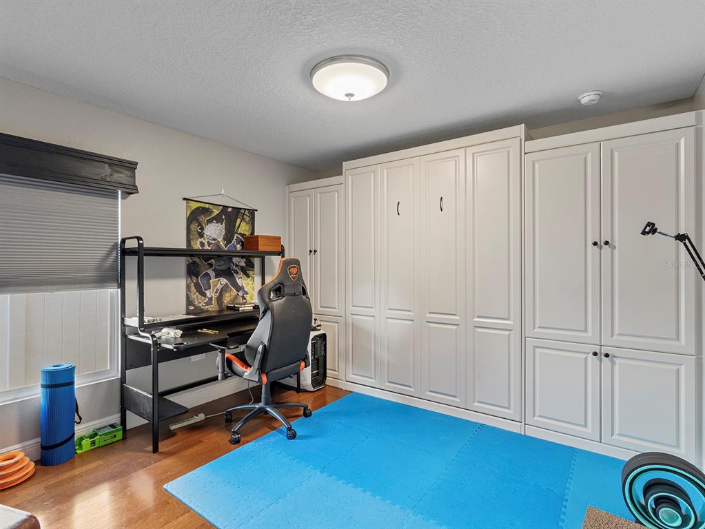 549 Placid Run Road Orange City, FL 32763 - Photo 17 of 20 a view of a workspace with furniture and gym equipment