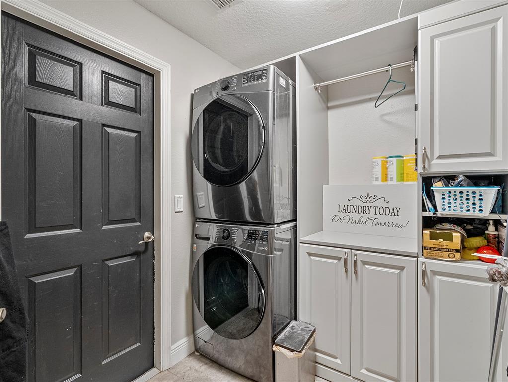 549 Placid Run Road Orange City, FL 32763 - Photo 18 of 20 a utility room with dryer and washer