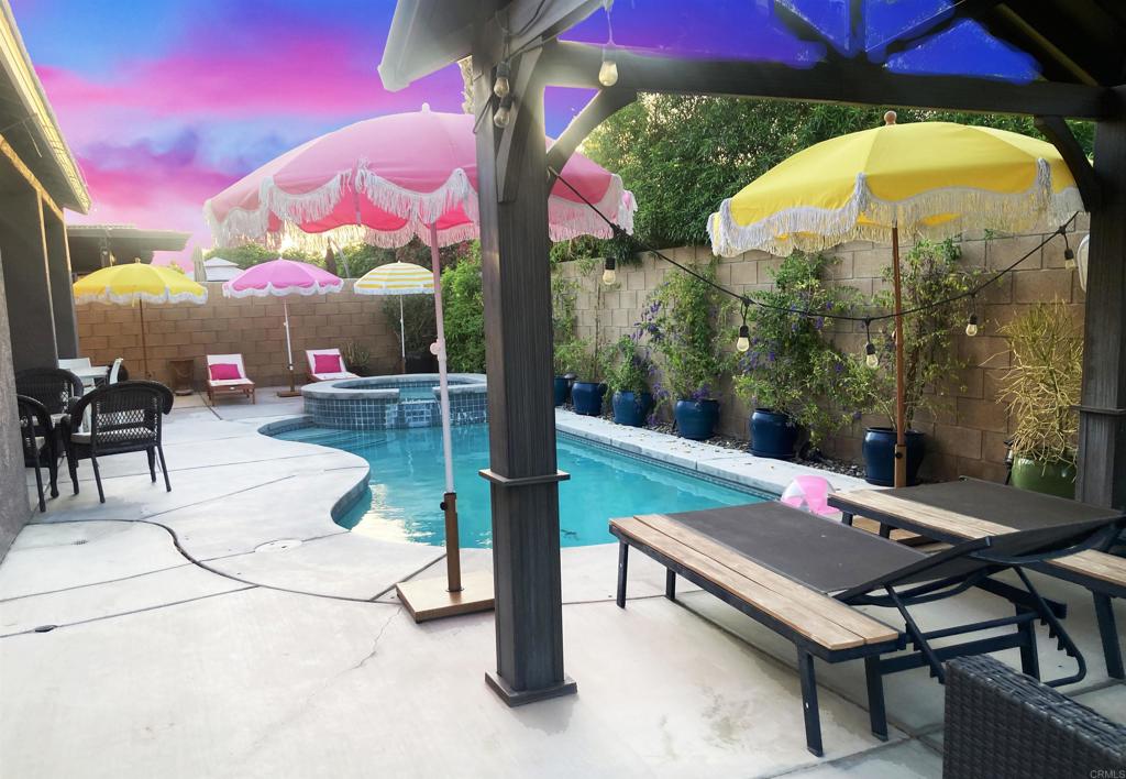 80596 Key Largo Avenue Indio, CA 92201 - Photo 43 of 59 an outdoor sitting area with couch and outdoor view