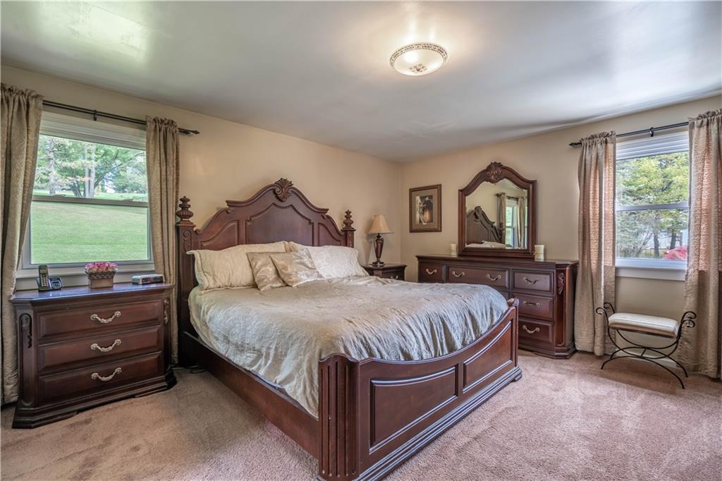 445 Springdale Road Eighty Four, PA 15330 - Photo 11 of 20 a bedroom with a bed and a dresser next to a window