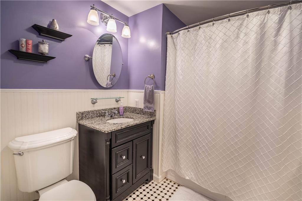445 Springdale Road Eighty Four, PA 15330 - Photo 14 of 20 a bathroom with a granite countertop sink vanity mirror and toilet