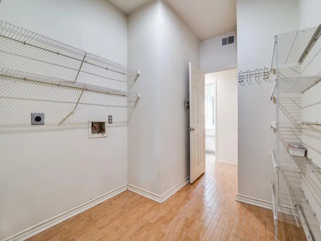 a view of a livingroom with wooden floor