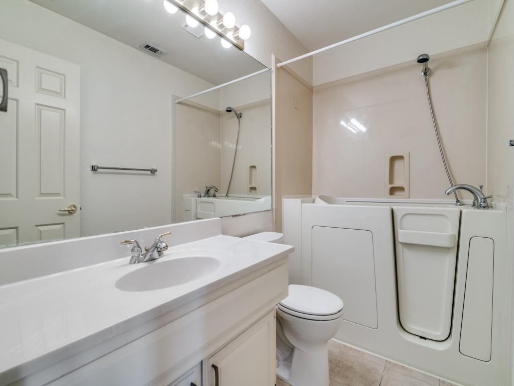 9981 Waterfront Trail Rowlett, TX 75087 - Photo 18 of 26 a bathroom with a sink toilet and shower