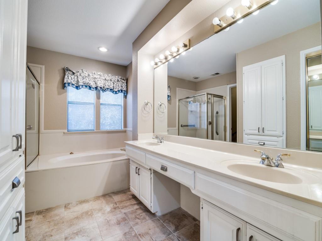 9981 Waterfront Trail Rowlett, TX 75087 - Photo 20 of 26 a bathroom with a tub double sink mirror and