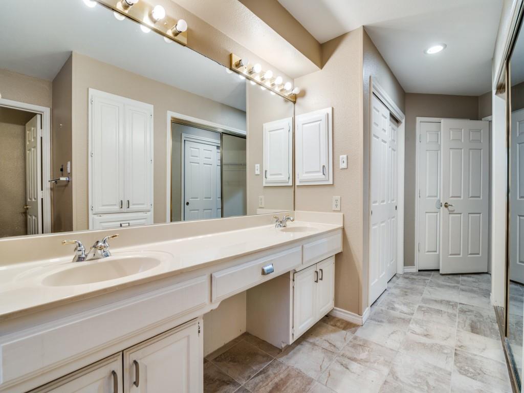 9981 Waterfront Trail Rowlett, TX 75087 - Photo 22 of 26 a spacious bathroom with a double vanity sink mirror and double