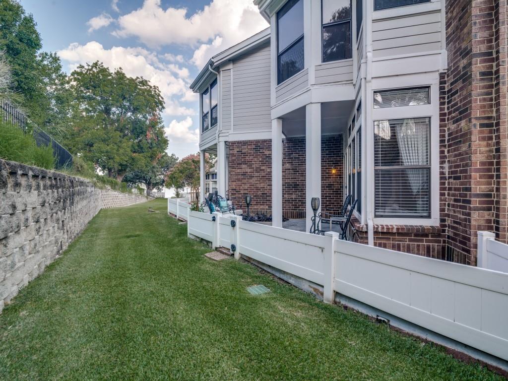 9981 Waterfront Trail Rowlett, TX 75087 - Photo 25 of 26 a view of a house with a yard and a large tree