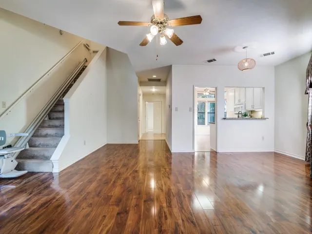 a view of a kitchen with wooden floor and a kitchen