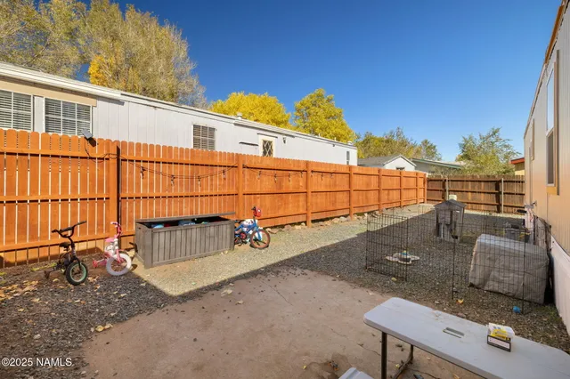 a view of a street with iron fence
