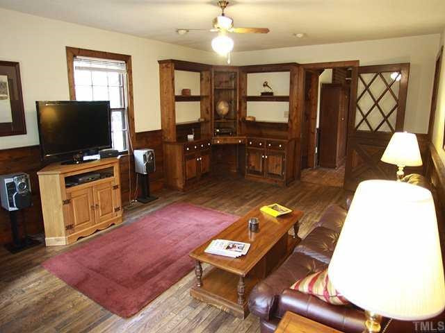 6600 Ten-Ten Road Apex, NC 27539 - Photo 5 of 25 Family room has hardwood floors and built-ins. Den/Family/Great Room