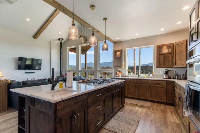 a kitchen with a sink stove and cabinets
