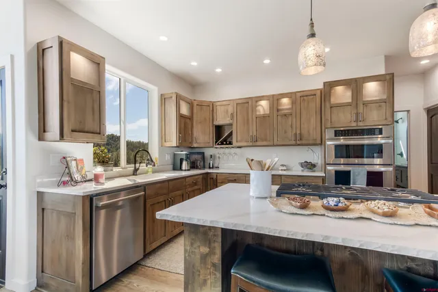 a kitchen with counter space cabinets and appliances