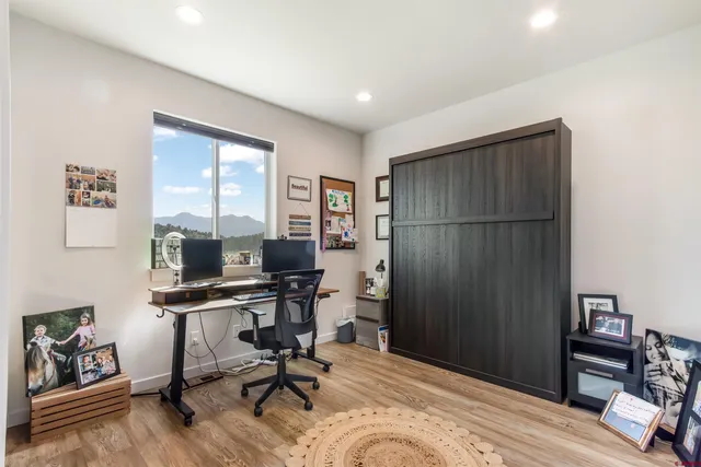 a workspace with furniture and a window