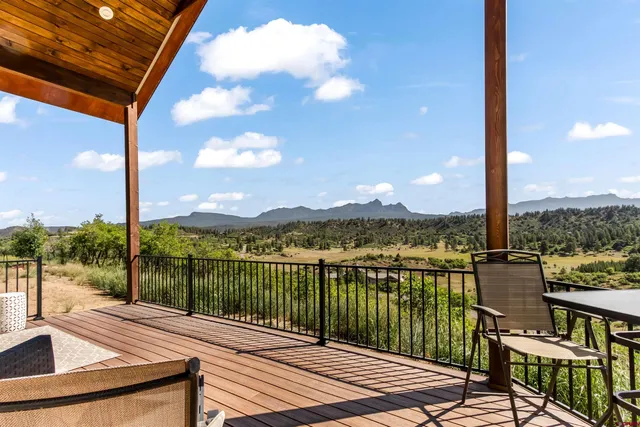 a view of a balcony with lake view and mountain view