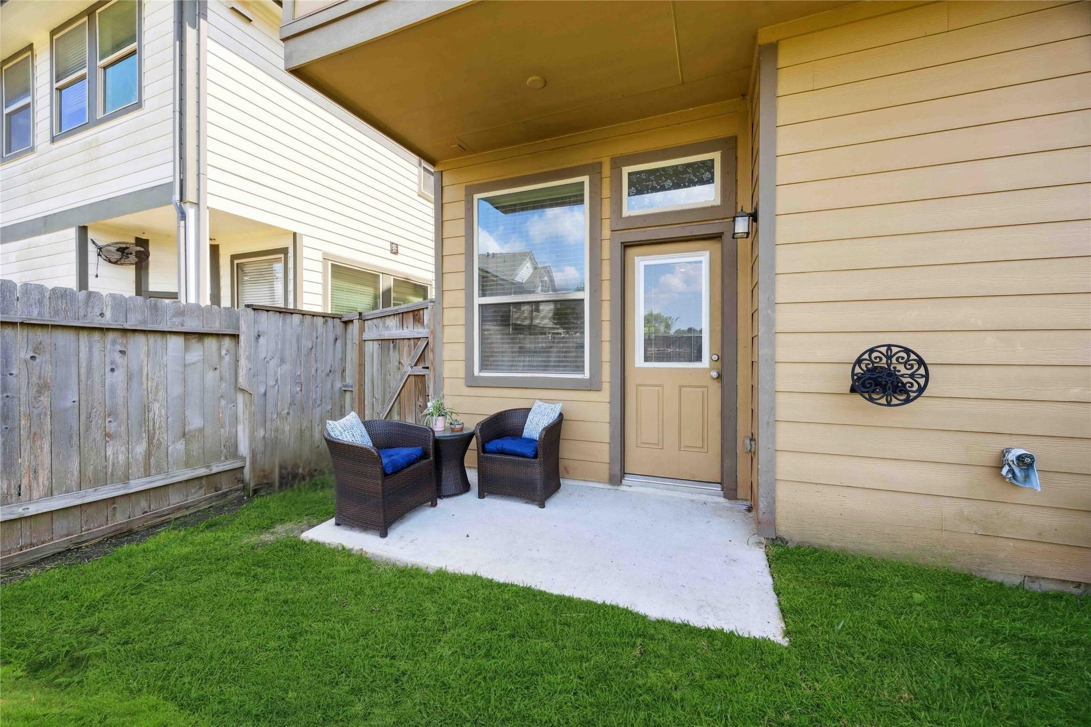 323 Biltmore Loop Montgomery, TX 77316 - Photo 26 of 27 Step outside to the patio area, ideal for casual outdoor living.