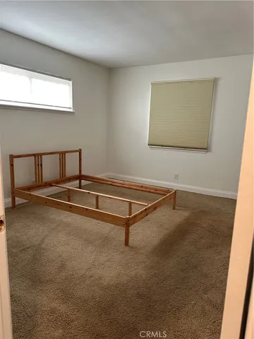 a view of an empty room with windows