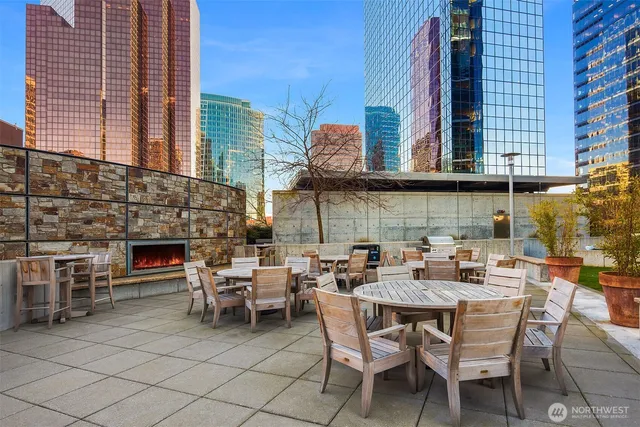 a view of a building with a dining table and chairs